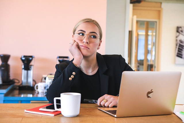 Bored staff member looking at computer