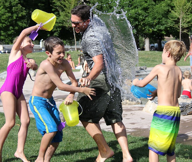 Children throwing water at each other