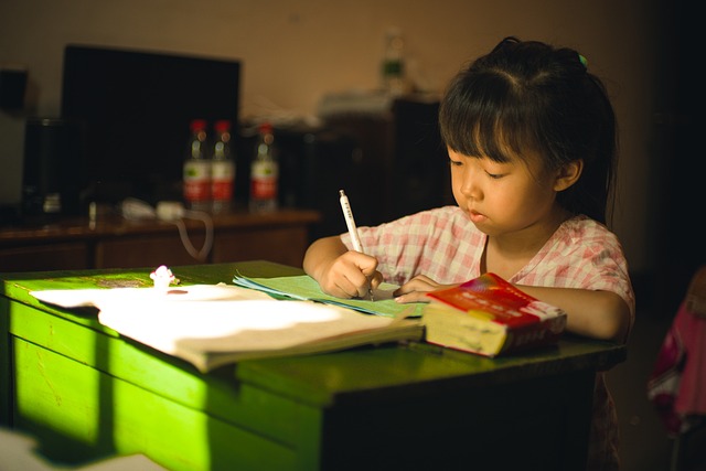 Young girl writing at desk