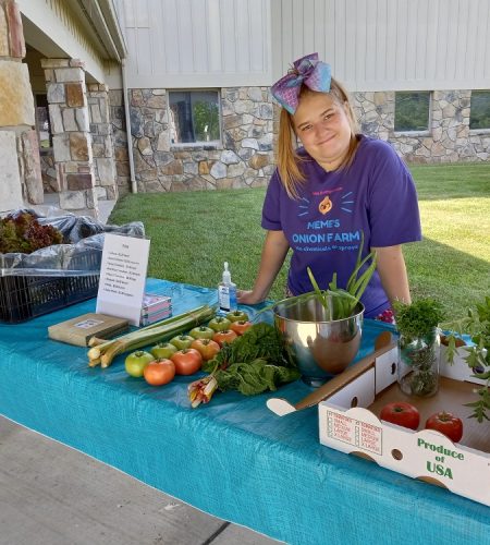 Girl selling vegetables