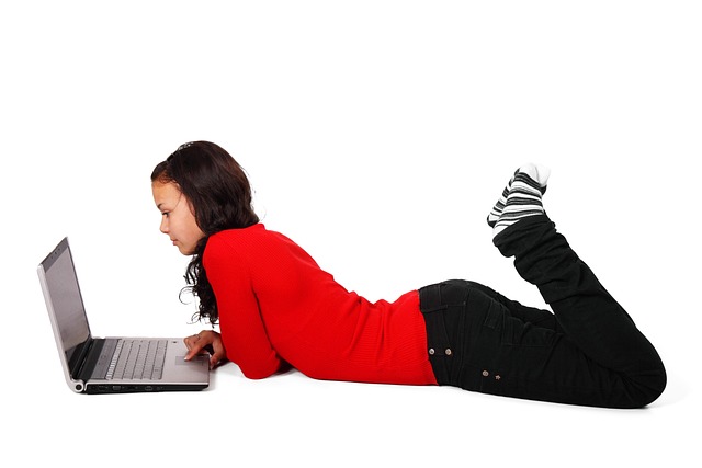 Girl laying down with computer