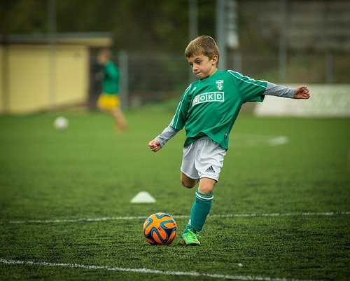 Boy playing soccer