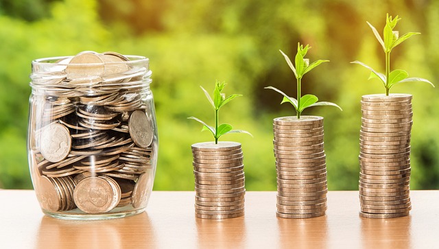 Stacks of coins and money in a jar