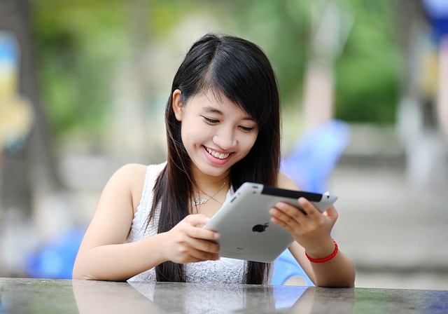 Teen looking at an ipad